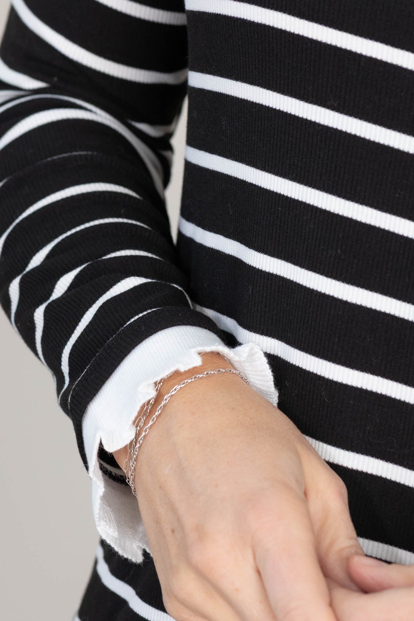 Black And White Striped Ruffle Hem Knit Top