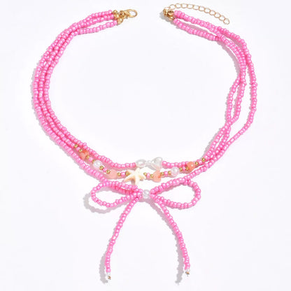 Beaded Three-Layered Necklace with Bow and Starfish Charms