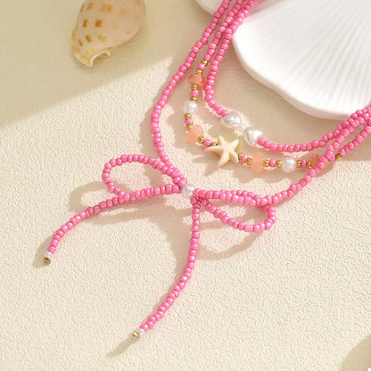 Beaded Three-Layered Necklace with Bow and Starfish Charms